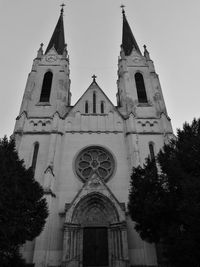 Low angle view of bell tower against sky