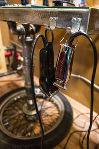 Close up of electric razors hanging on hooks at barber shop
