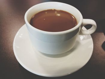 High angle view of coffee cup on table