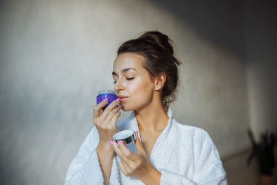 Young woman drinking water