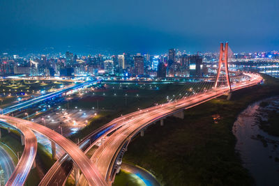 High angle view of illuminated highway at night