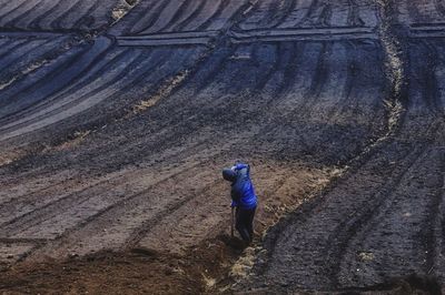 Full length of woman standing by railing
