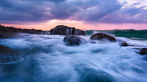 Scenic view of sea against sky during sunset