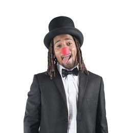 Portrait of smiling man wearing hat against white background