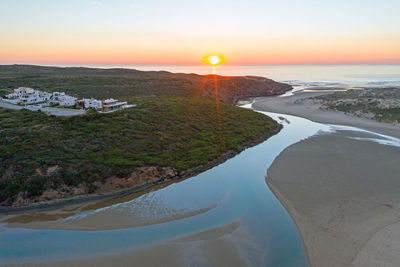 Scenic view of sea against sky during sunset