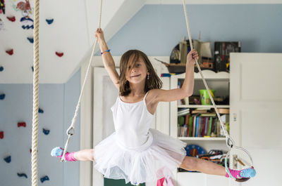 Girl doing splits while hanging