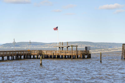 Pier over sea against sky