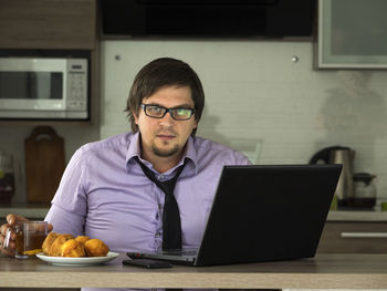 Businessman using laptop at home