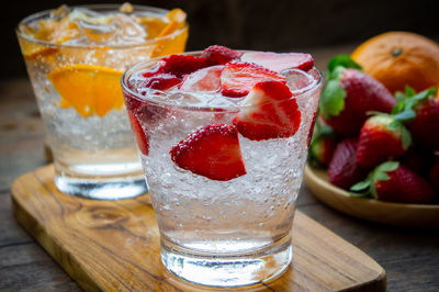 Close-up of drinks with fruits on table