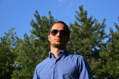 Low angle view of man standing against sky