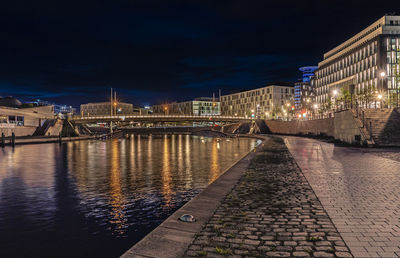 Illuminated buildings in city at night