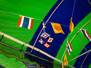 Close-up of flags hanging on wall