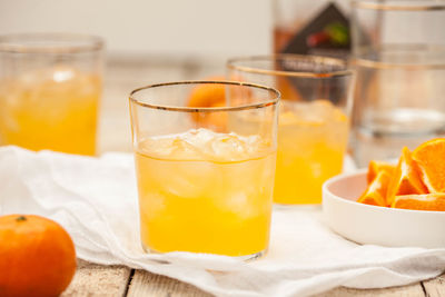 Close-up of orange juice on table