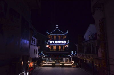 Illuminated buildings in city at night