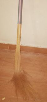 Close-up of wooden floor against wall at home