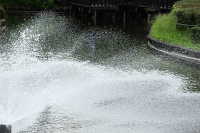 Fountain in front of waterfall