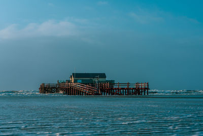 Pile dwelling on the beach of sankt peter-ording in germany.