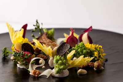 Close-up of flowers in plate on table