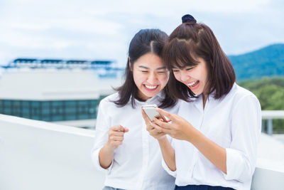 Young woman using mobile phone