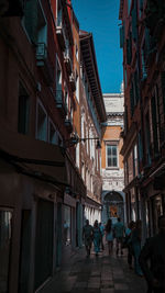 People walking on street in city
