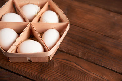High angle view of eggs in box on table