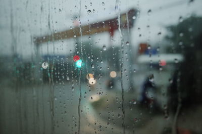 Full frame shot of wet glass window in rainy season