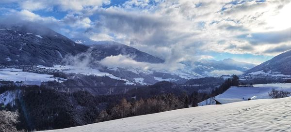 Scenic view of snowcapped mountains against sky