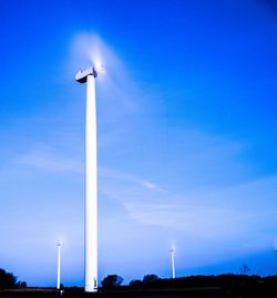 Low angle view of street light against blue sky