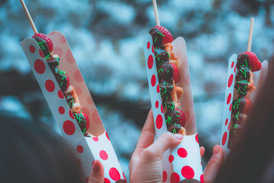 Cropped hands holding food