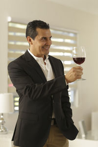 Portrait of a man drinking glasses