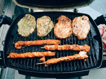 Close-up of meat on barbecue grill