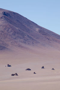 Scenic view of desert against clear sky