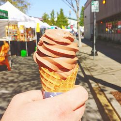 Cropped image of man holding ice cream