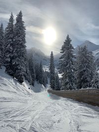 Scenic view of snow covered mountains against sky