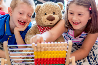 Portrait of a smiling girl with toy