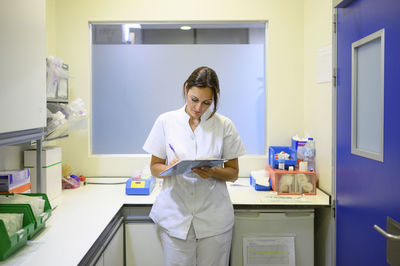 Female doctor examining chemical in clinic