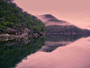 Scenic view of lake against sky during sunset