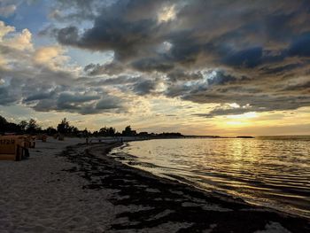 Scenic view of beach against sky during sunset