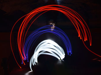 Light trails in amusement park at night