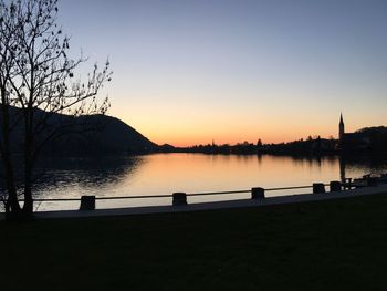 Scenic view of calm lake at sunset