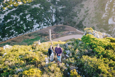 High angle view of people standing on mountain