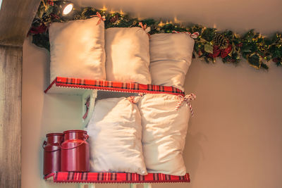 Cushions on shelf at home during christmas
