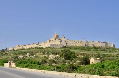 View of historical building against clear blue sky