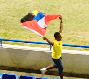 Full length of boy standing in park