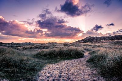 Scenic view of landscape against sky during sunset