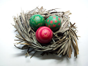 Close-up of multi colored eggs in nest