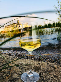Close-up of beer in water against sky