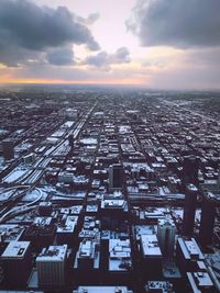 High angle view of buildings against sky during sunset