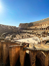 Low angle view of old ruins - roman colosseum , italy