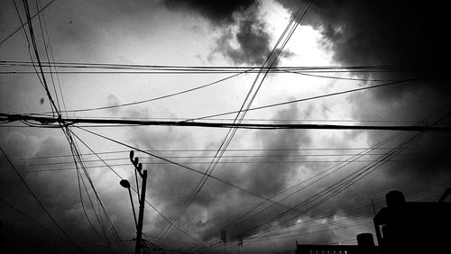 Low angle view of electricity pylon against sky